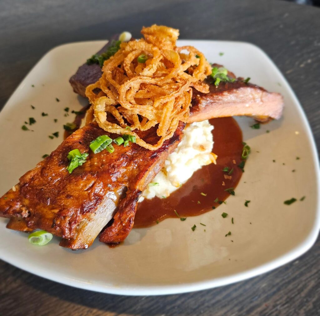 Country Ribs: Ribs cooked until fall off the bone tender in a BBQ beef gravy, served over mashed potatoes and topped with crispy onions.
