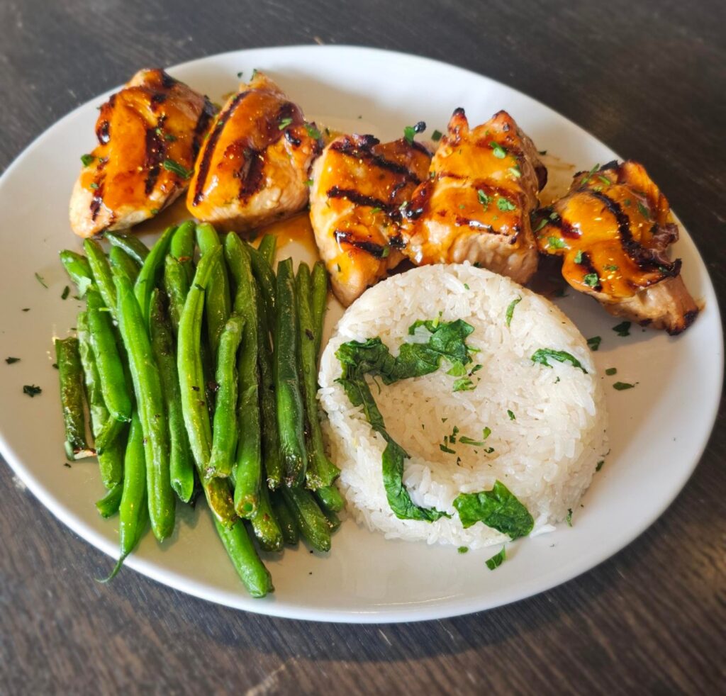 Turkey Tips: Tender turkey breast marinated in our Latin inspired chimichurri marinade, brushed with teriyaki glaze. Served with rice & fresh vegetables.
