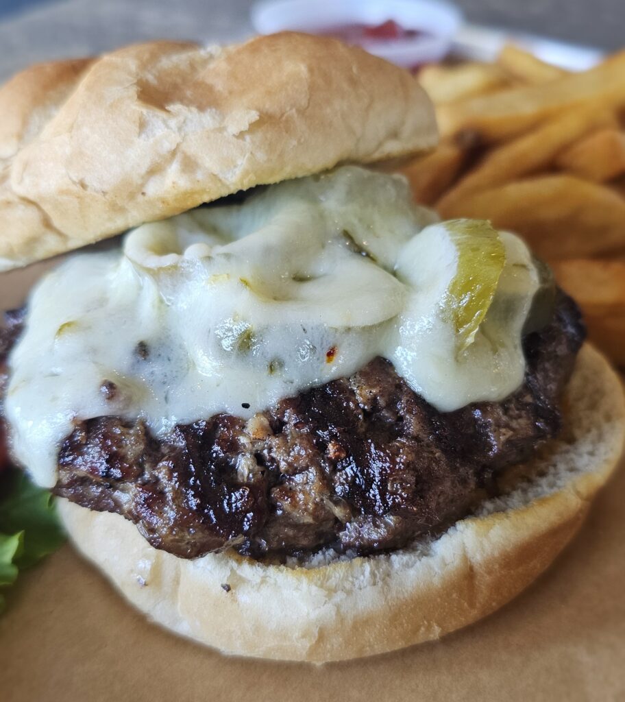 Diablo Burger: Hand pressed ½ pound of USDA choice ground sirloin, dusted with Cajun spices & grilled to your desired doneness, topped with jalapeños and pepper jack cheese on a toasted burger roll slathered with our house made Siracha mayo.