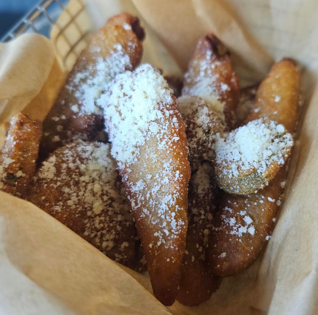 Fried Pickles: Tangy dill pickles coated with a mildly spiced breading, fried crisp and dusted with parmesan cheese. Served with creamy ranch dipping sauce.