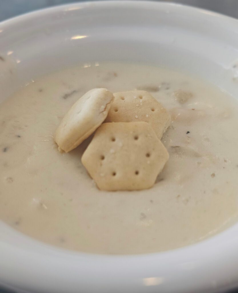 Clam Chowder: A New England favorite! Creamy goodness, loaded with clams & chunks of potatoes. Served with oyster crackers.